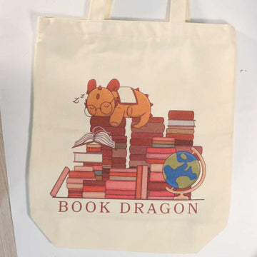 Sleepy Book Dragon Design Tote Bag